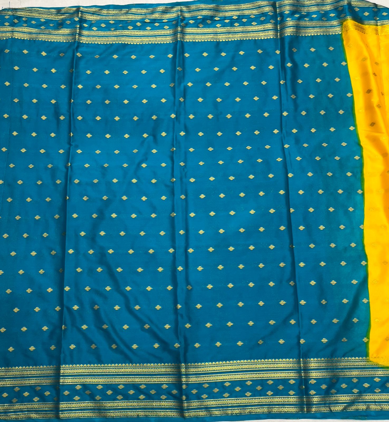 Premium Yellow Crape Saree with Blue Border.