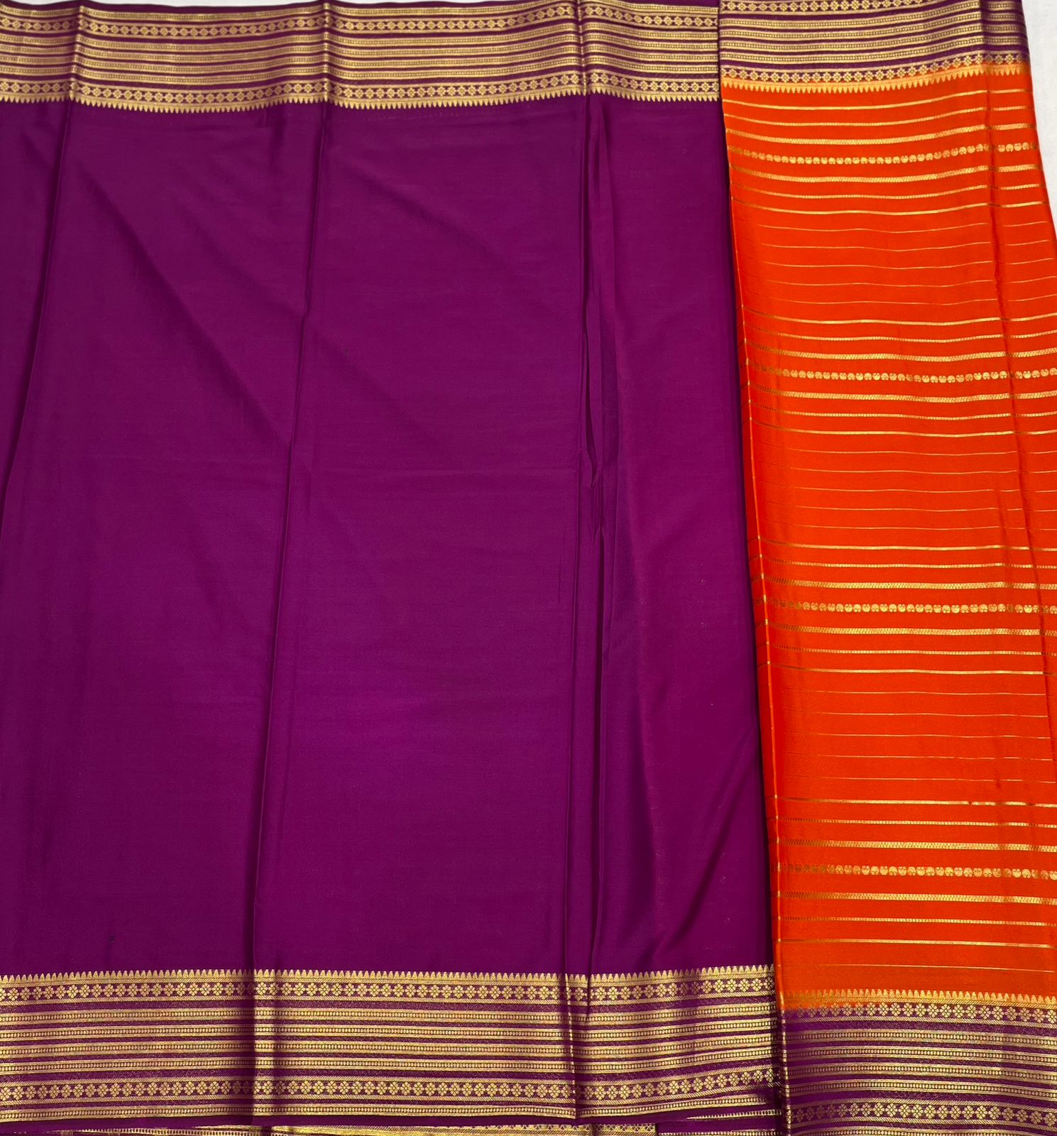 Orange Premium Crape Striped Saree with Purple border.