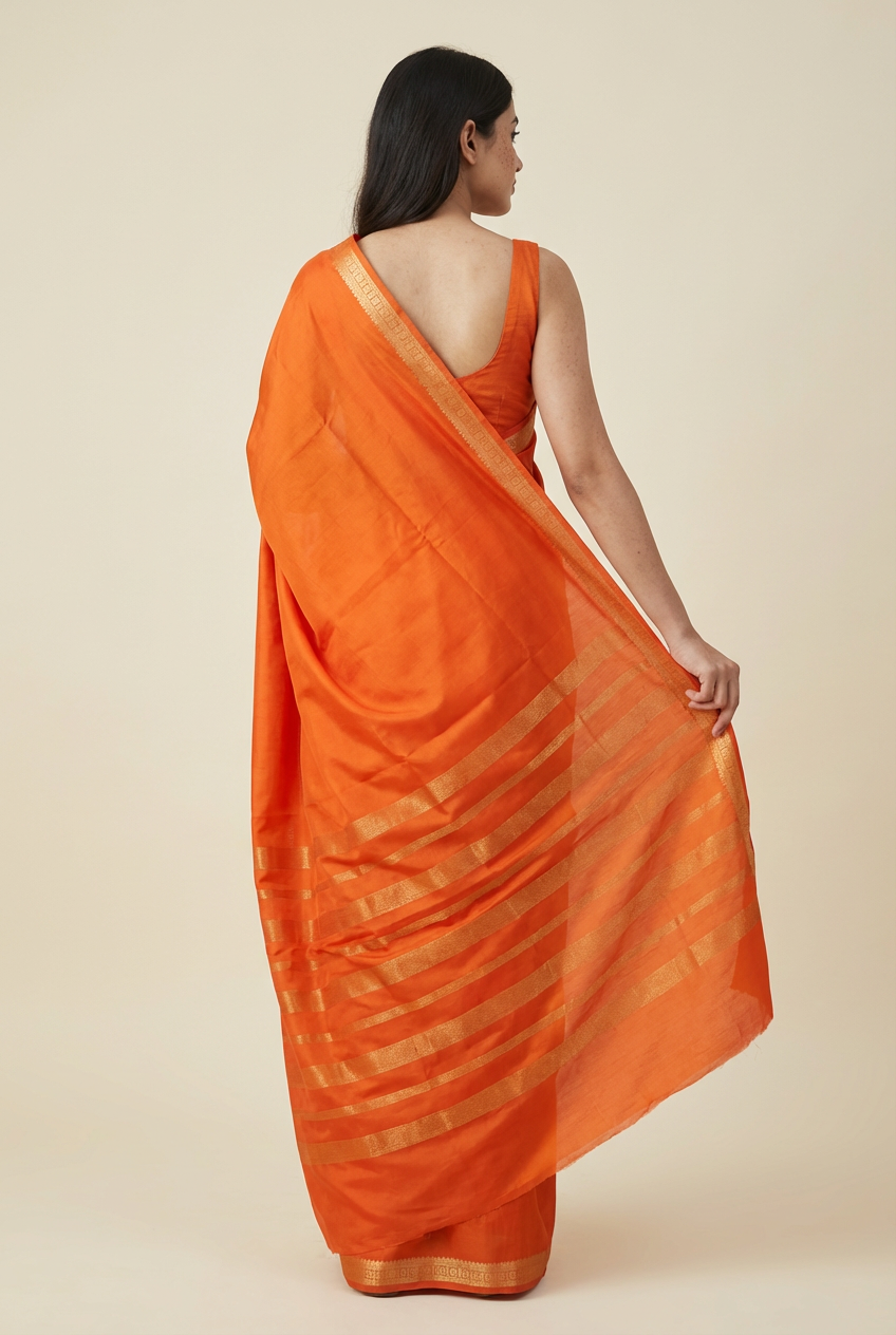 Graceful Orange Crape Saree – Silk Studio Festive Collection