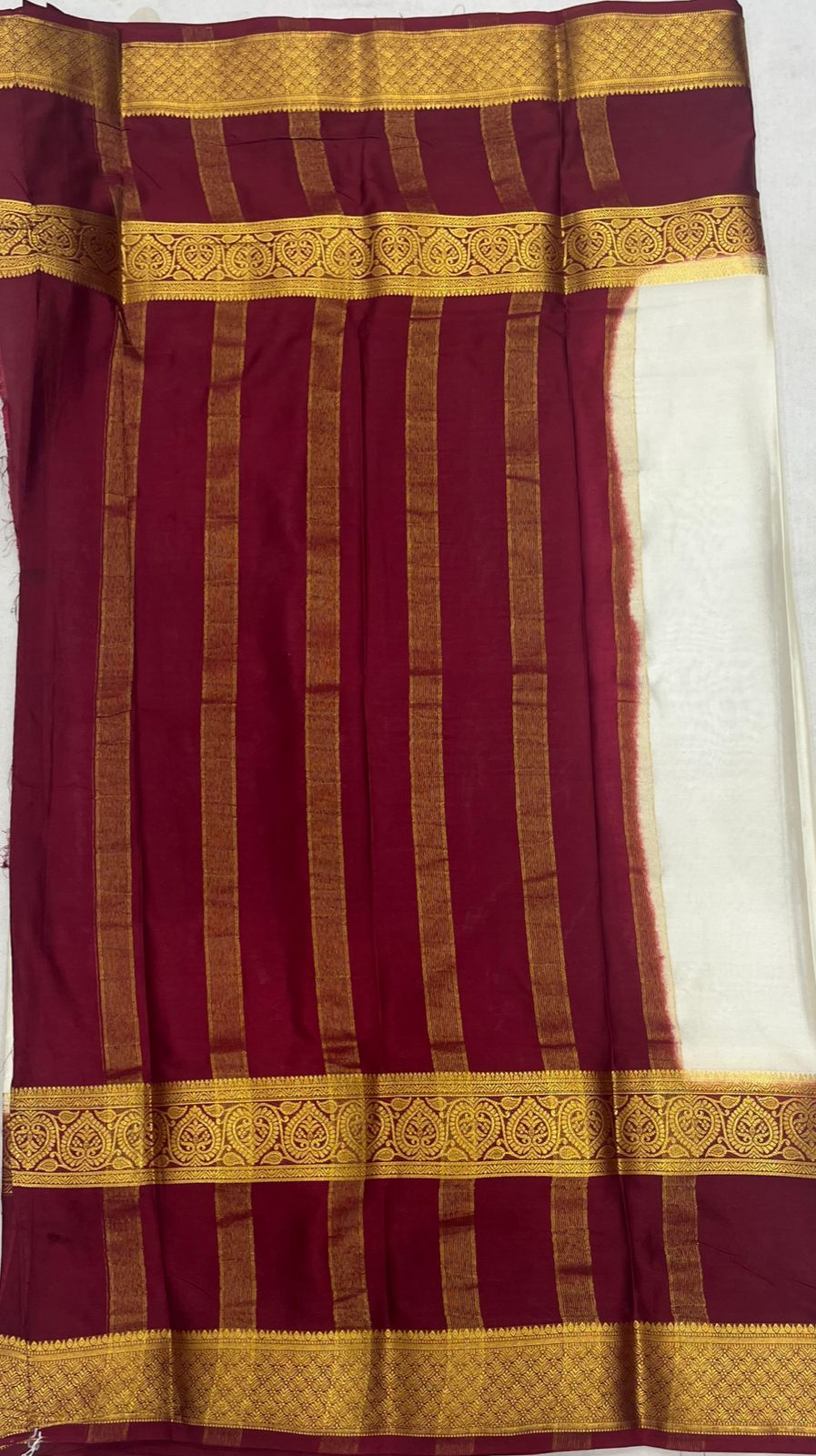Elegant Cream Crape Saree with Maroon border.