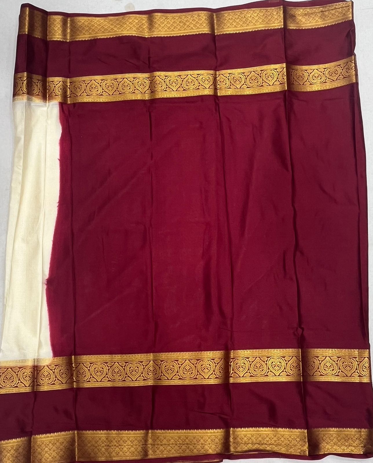 Elegant Cream Crape Saree with Maroon border.