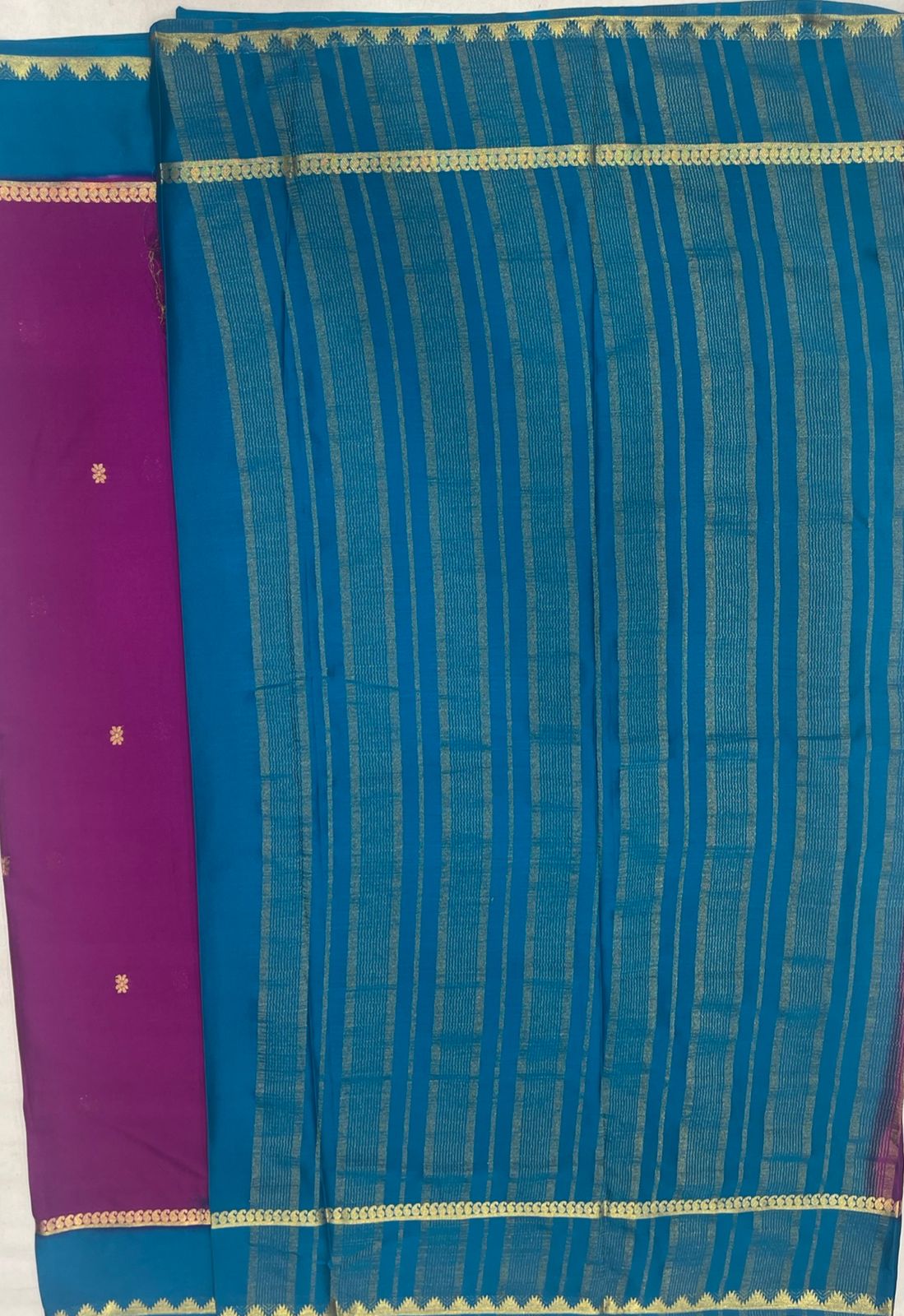 Graceful Rani pink Crape Saree with Blue border.