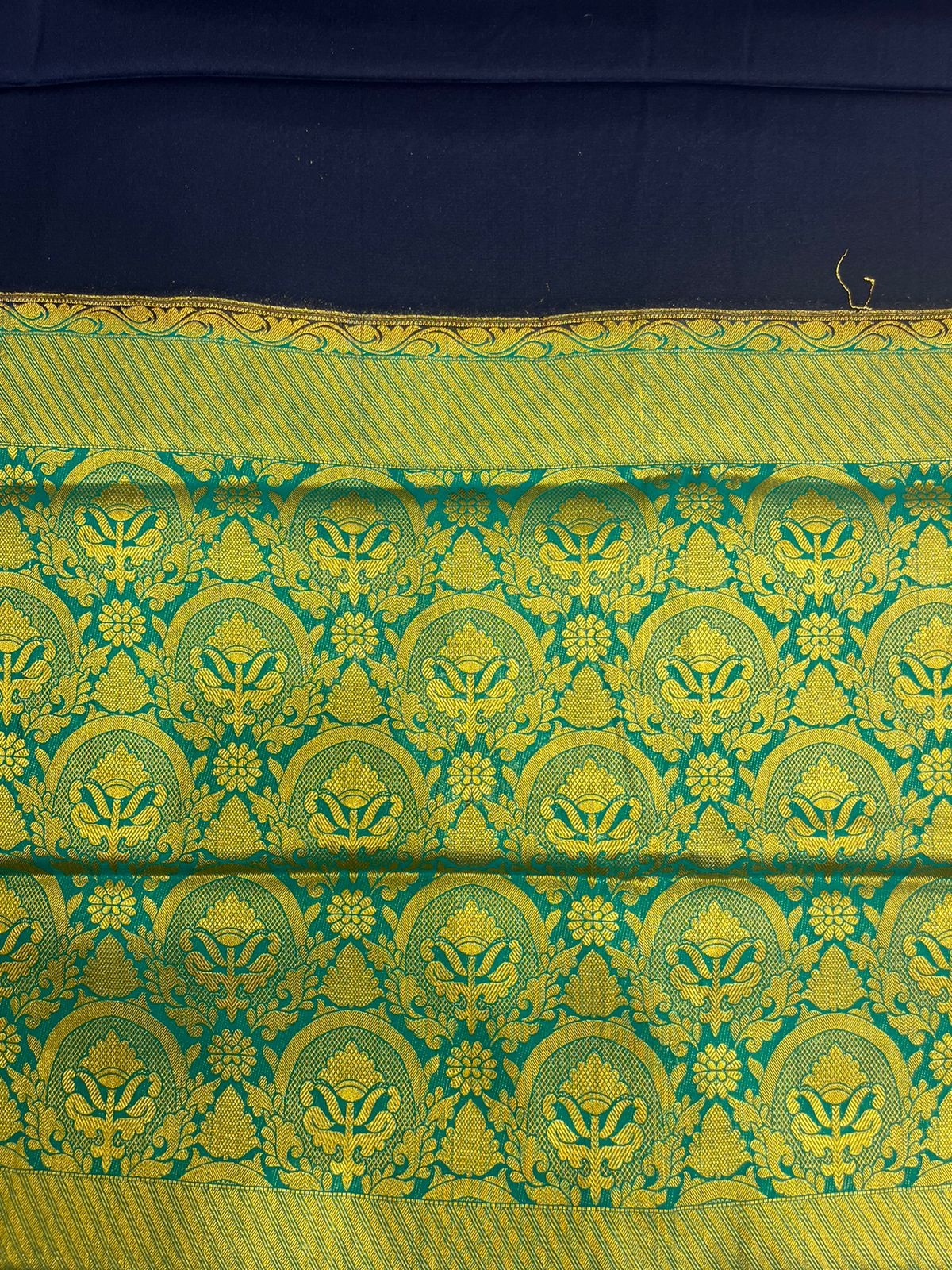 Silk Studio Navy Blue Crape Saree with Elegant Green Contrast Border