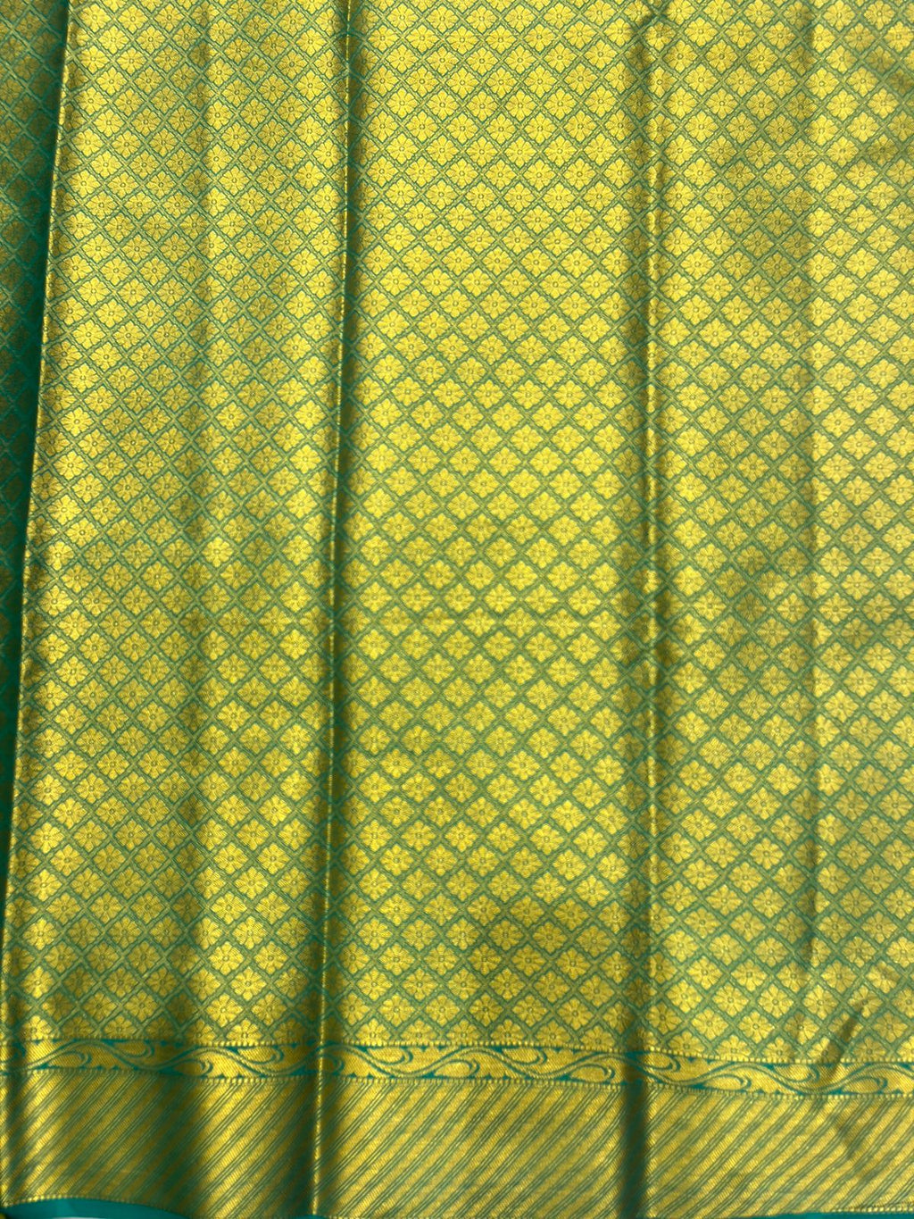 Silk Studio Navy Blue Crape Saree with Elegant Green Contrast Border