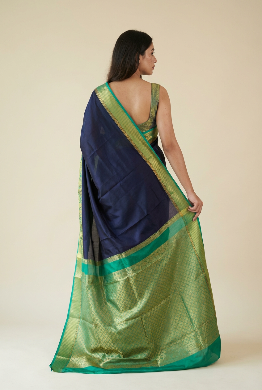 Silk Studio Navy Blue Crape Saree with Elegant Green Contrast Border
