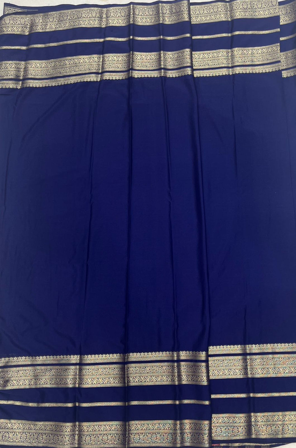 Navy Blue Premium Crape Saree with silver color border.