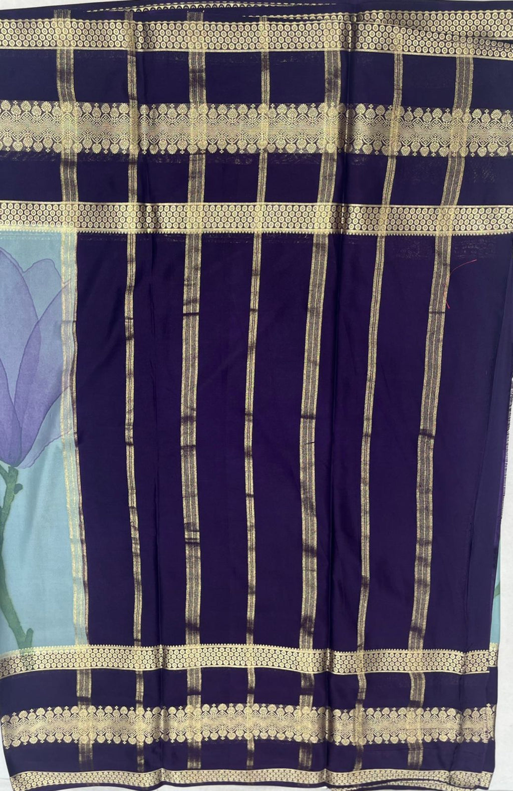 Sky-Blue Crape Saree with Navy blue Border.