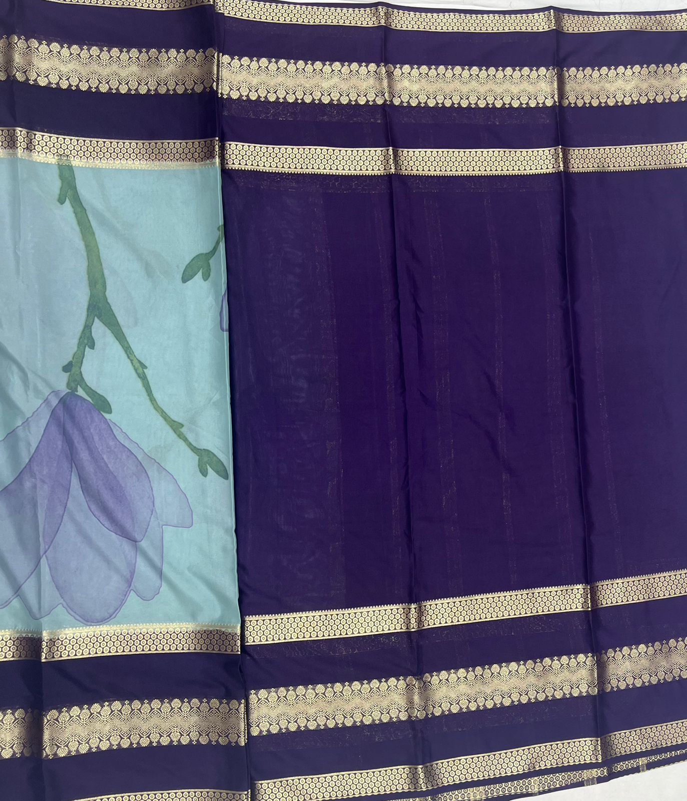 Sky-Blue Crape Saree with Navy blue Border.