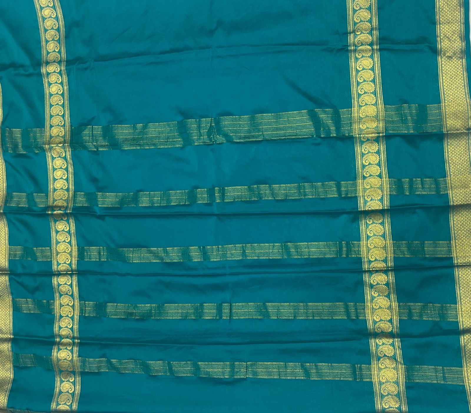 Teal Green Fancy Crepe Saree with Antique Gold Border