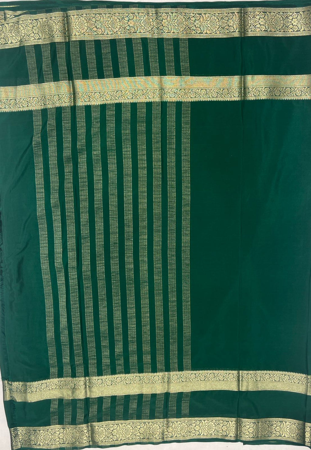 Dark Green Elegant Crape Saree with Silver border.