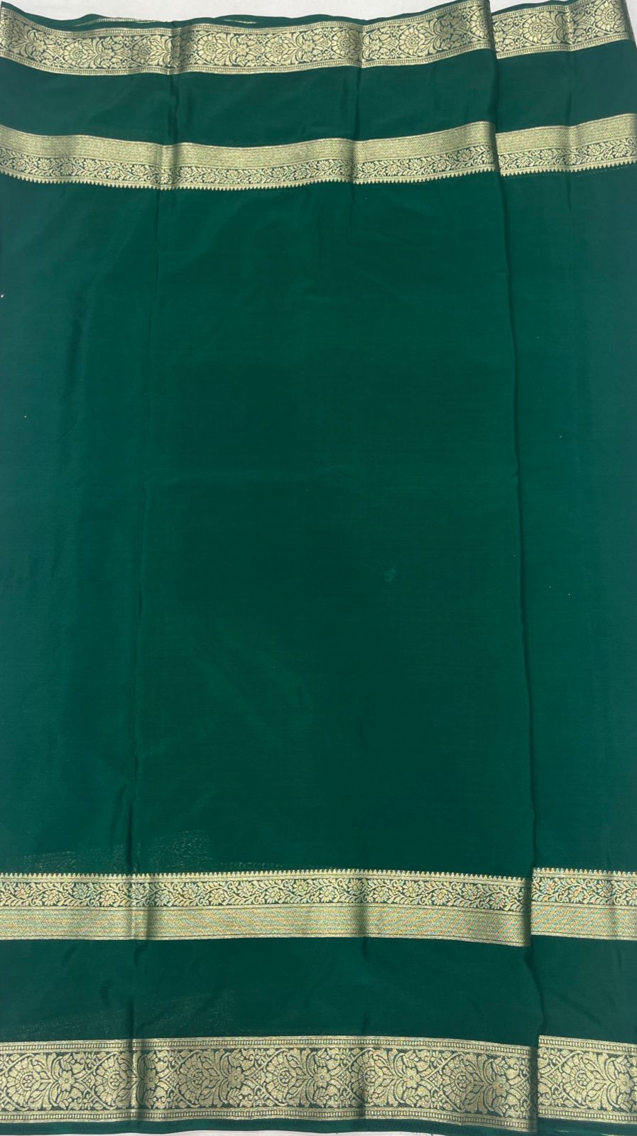 Dark Green Elegant Crape Saree with Silver border.