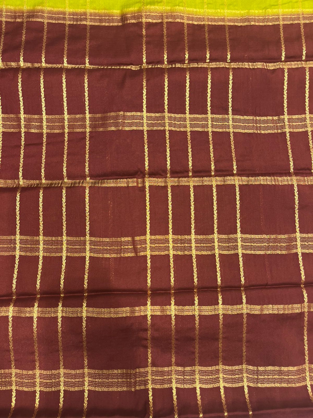 Silk Studio Parrot Green Crape Saree with Brown Contrast Border.