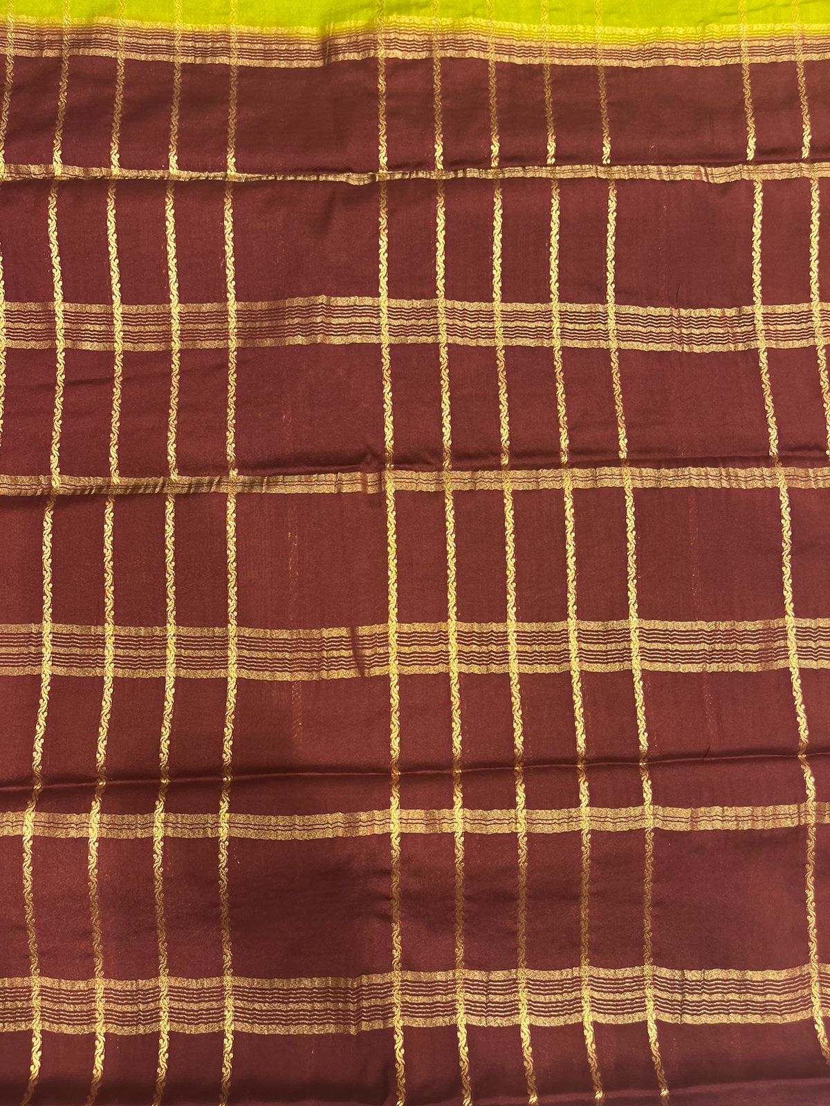 Silk Studio Parrot Green Crape Saree with Brown Contrast Border.