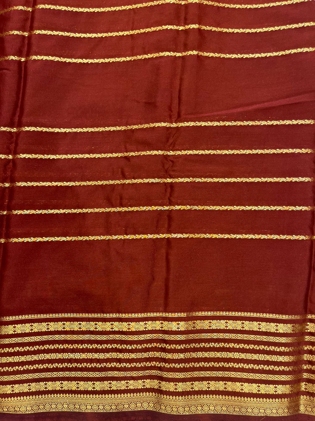 Silk Studio Parrot Green Crape Saree with Brown Contrast Border.