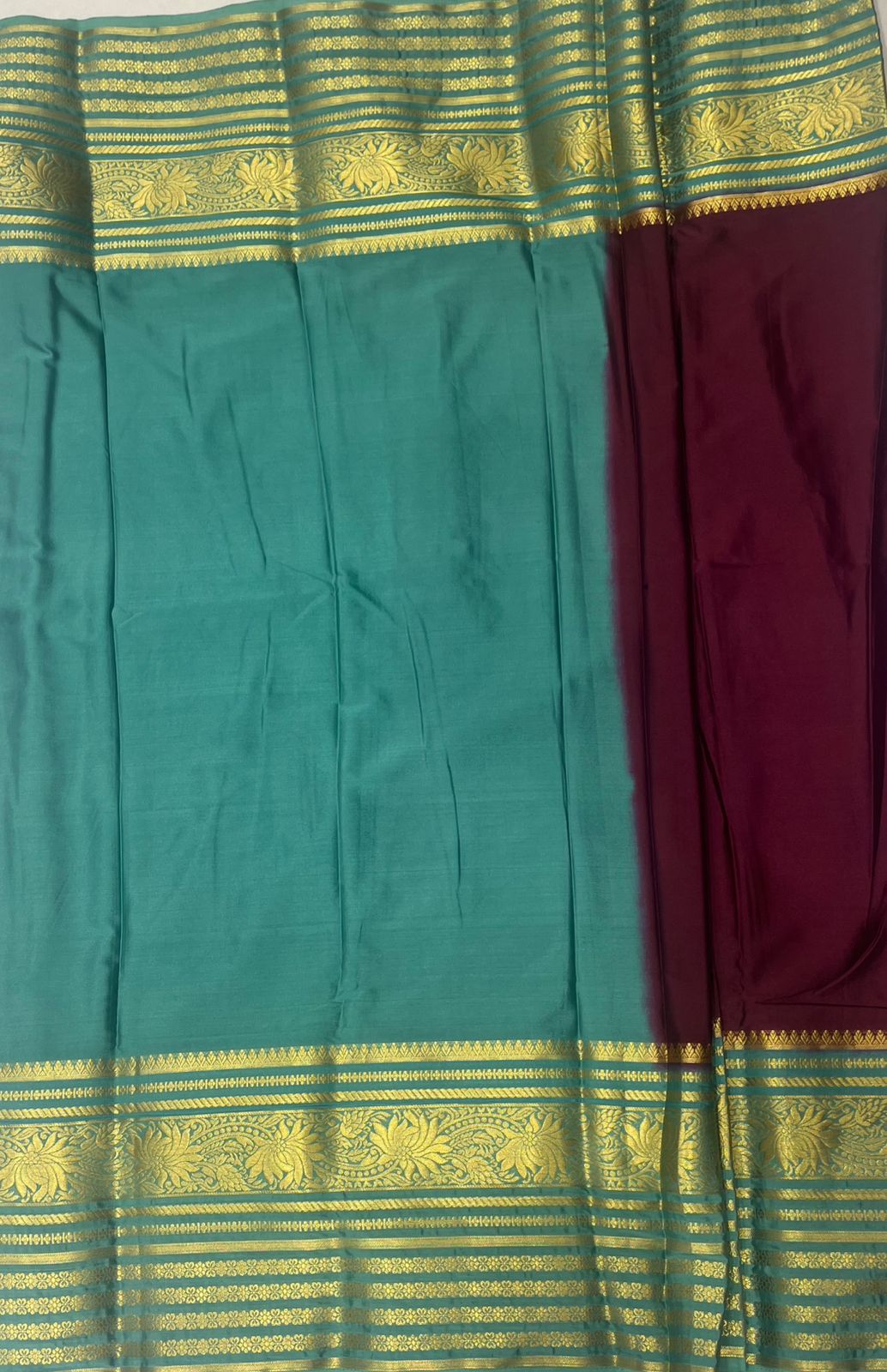 Dark Maroon Crape Saree with Premium Blue Striped border.
